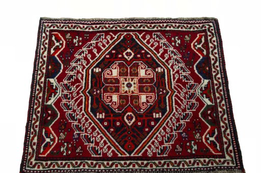 Surface texture of 2000s Shiraz rug with natural Wool and intricate pattern