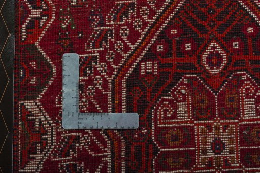 Backside of handmade 2000s Shiraz rug showing knot structure and weave density