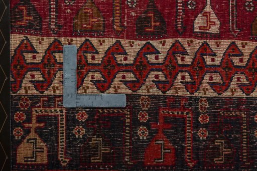 Backside of handmade 2000s Shiraz rug showing knot structure and weave density