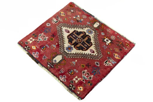 Corner detail of 2000s Shiraz rug showing border pattern and Wool pile
