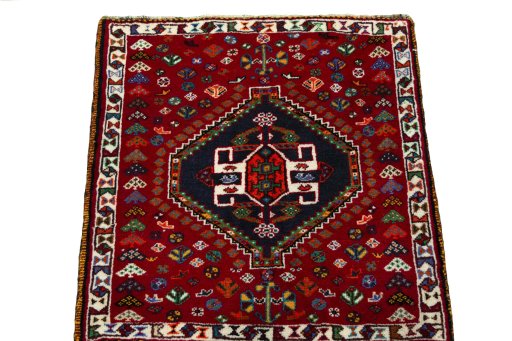 Surface texture of 2000s Shiraz rug with natural Wool and intricate pattern