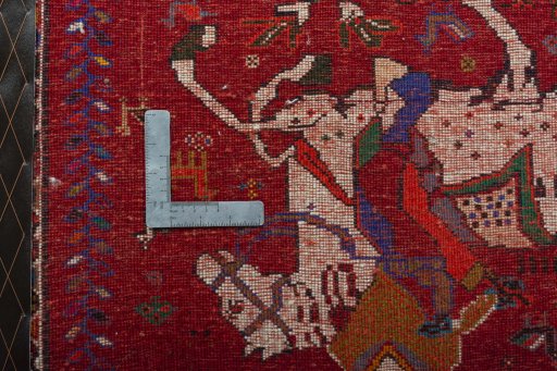 Backside of handmade 2000s Shiraz rug showing knot structure and weave density