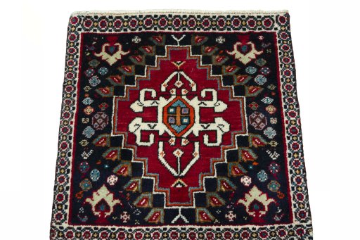 Surface texture of 2000s Shiraz rug with natural Wool and intricate pattern