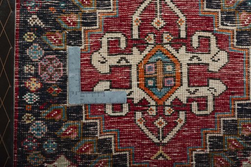 Backside of handmade 2000s Shiraz rug showing knot structure and weave density