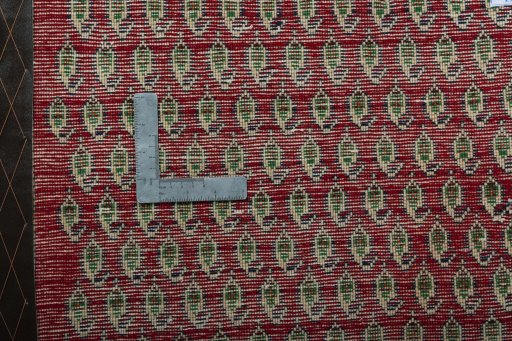Backside of handmade 2000s Shiraz rug showing knot structure and weave density