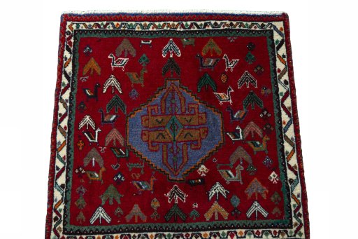 Surface texture of 2000s Shiraz rug with natural Wool and intricate pattern