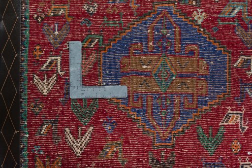 Backside of handmade 2000s Shiraz rug showing knot structure and weave density