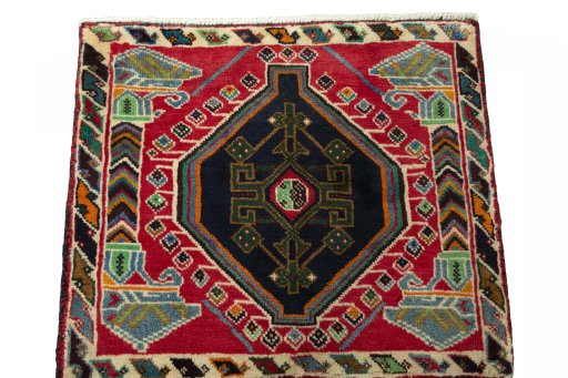 Surface texture of 2000s Shiraz rug with natural Wool and intricate pattern