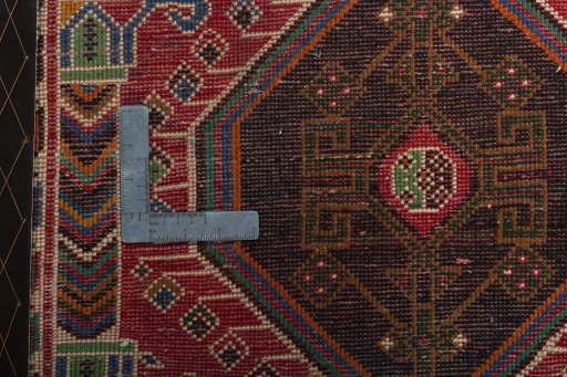 Backside of handmade 2000s Shiraz rug showing knot structure and weave density
