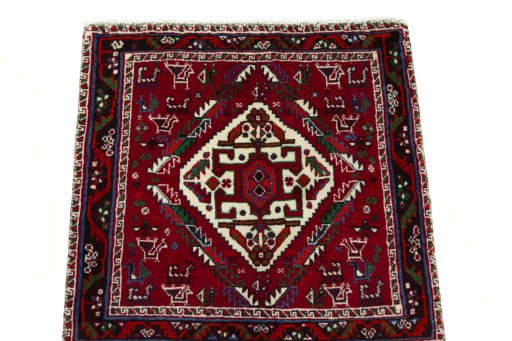 Surface texture of 2000s Shiraz rug with natural Wool and intricate pattern