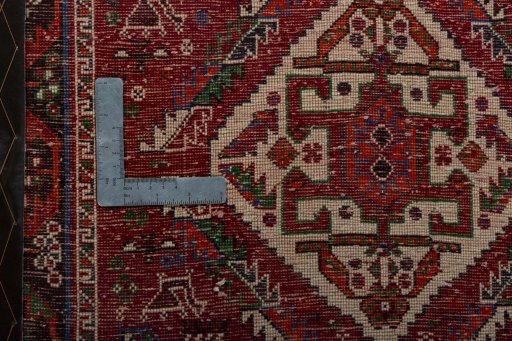 Backside of handmade 2000s Shiraz rug showing knot structure and weave density