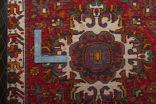 Backside of handmade 2000s Shiraz rug showing knot structure and weave density