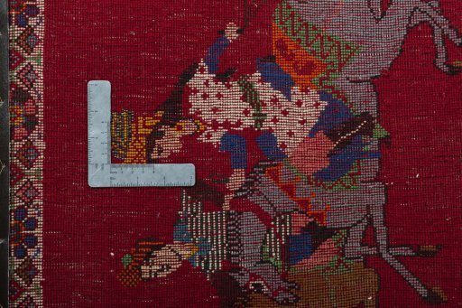 Backside of handmade 2000s Shiraz rug showing knot structure and weave density