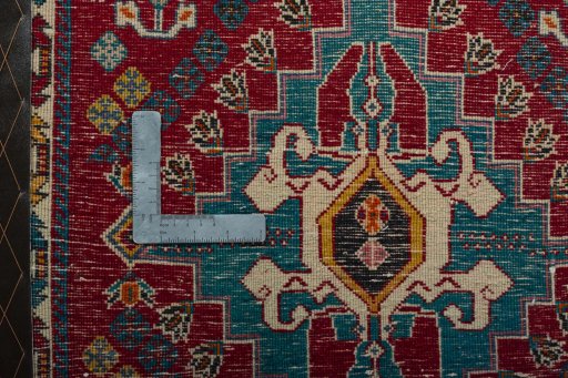 Backside of handmade 2000s Shiraz rug showing knot structure and weave density