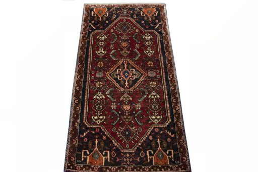 Surface texture of 2000s Shiraz rug with natural Wool and intricate pattern