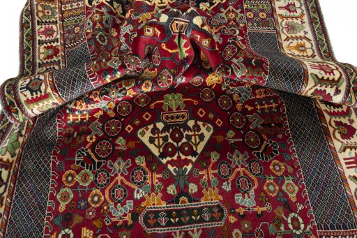 Corner detail of 2000s Shiraz rug showing border pattern and Wool pile