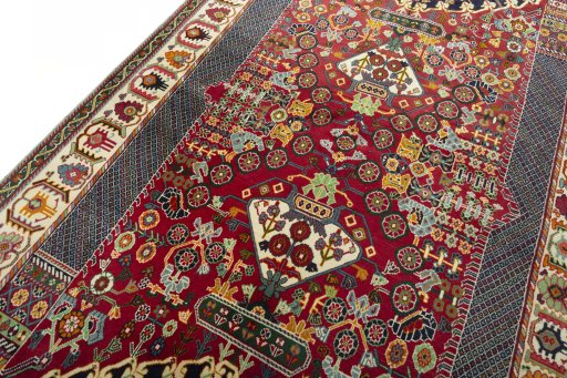 Backside of handmade 2000s Shiraz rug showing knot structure and weave density