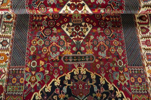 Full view of 2000s Shiraz rug from Iran / Persia, 280 × 173 cm in Red tones