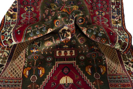 Corner detail of 2000s Shiraz rug showing border pattern and Wool pile