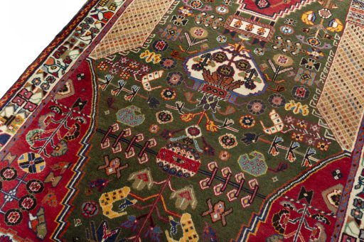 Backside of handmade 2000s Shiraz rug showing knot structure and weave density