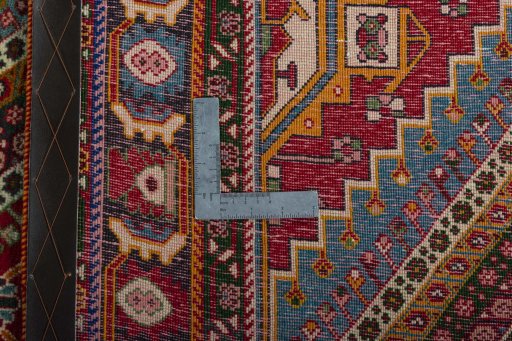Surface texture of 2000s Shiraz rug with natural Wool and intricate pattern