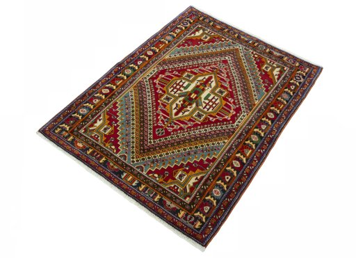 Corner detail of 2000s Shiraz rug showing border pattern and Wool pile