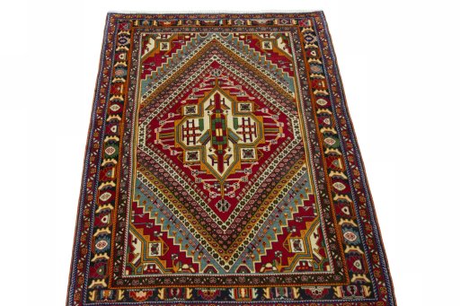 Surface texture of 2000s Shiraz rug with natural Wool and intricate pattern