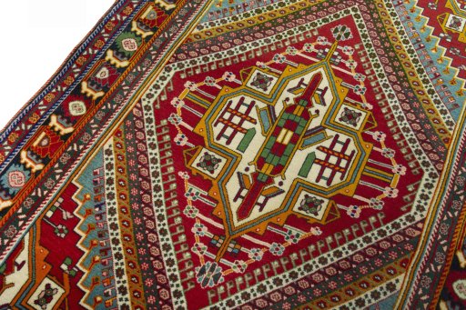 Backside of handmade 2000s Shiraz rug showing knot structure and weave density