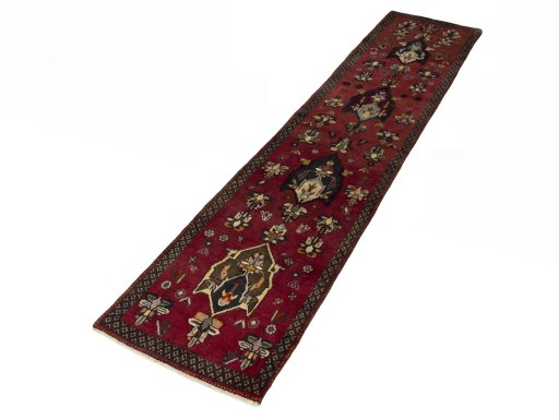 Corner detail of 2000s Shiraz rug showing border pattern and Wool pile