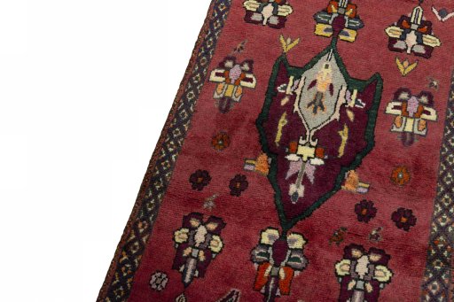 Backside of handmade 2000s Shiraz rug showing knot structure and weave density