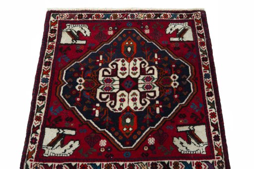Surface texture of 2000s Shiraz rug with natural Wool and intricate pattern
