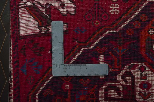 Backside of handmade 2000s Shiraz rug showing knot structure and weave density