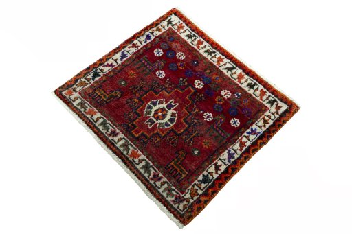Corner detail of 2000s Shiraz rug showing border pattern and Wool pile