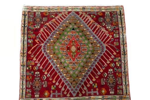 Surface texture of 2000s Shiraz rug with natural Wool and intricate pattern