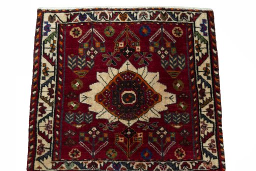 Surface texture of 2000s Shiraz rug with natural Wool and intricate pattern