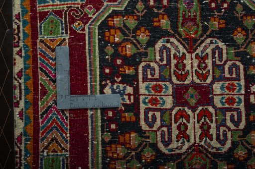 Backside of handmade 2000s Shiraz rug showing knot structure and weave density