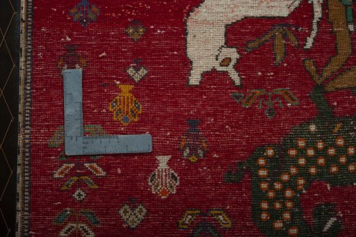 Backside of handmade 2000s Shiraz rug showing knot structure and weave density