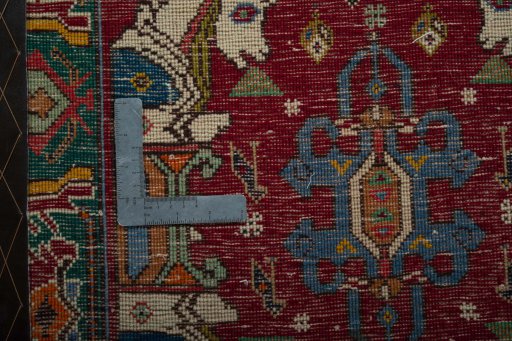 Backside of handmade 2000s Shiraz rug showing knot structure and weave density