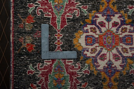 Backside of handmade 2000s Shiraz rug showing knot structure and weave density