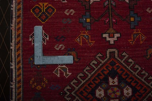 Corner detail of 2000s Shiraz rug showing border pattern and Wool pile