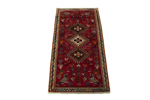 Surface texture of 2000s Shiraz rug with natural Wool and intricate pattern