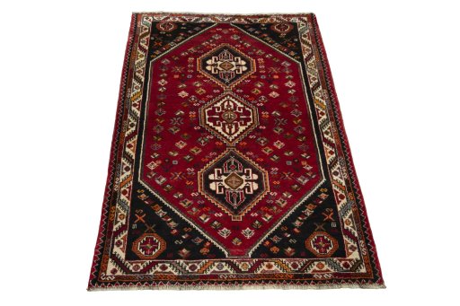 Surface texture of 2000s Shiraz rug with natural Wool and intricate pattern