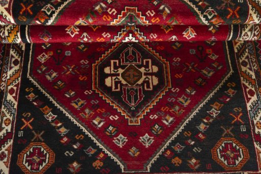 Full view of 2000s Shiraz rug from Iran / Persia, 174 × 110 cm in Red tones