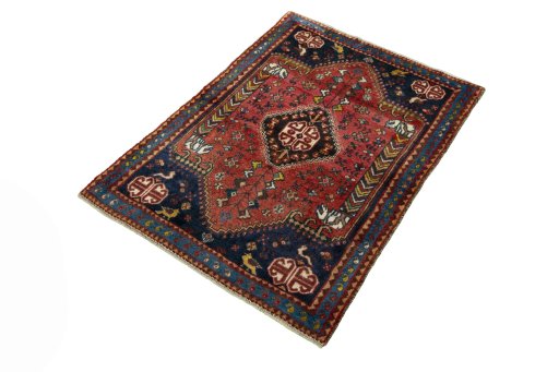 Corner detail of 2000s Shiraz rug showing border pattern and Wool pile