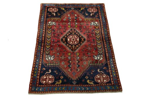 Surface texture of 2000s Shiraz rug with natural Wool and intricate pattern