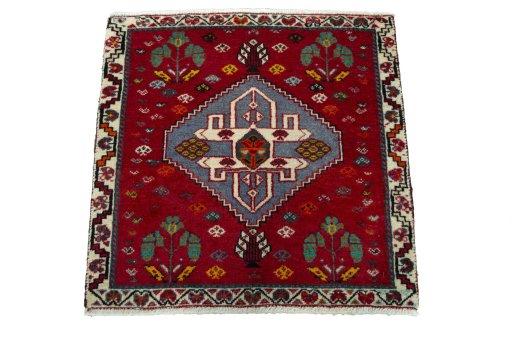 Surface texture of 2000s Shiraz rug with natural Wool and intricate pattern