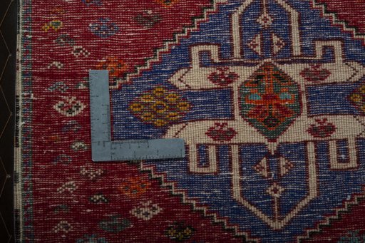 Backside of handmade 2000s Shiraz rug showing knot structure and weave density