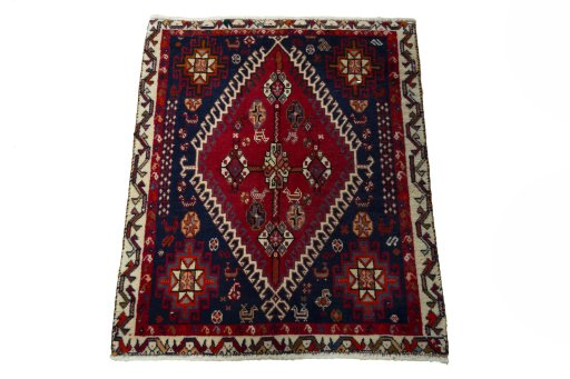 Surface texture of 2000s Shiraz rug with natural Wool and intricate pattern