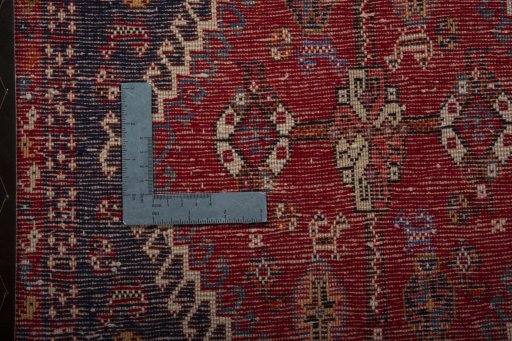 Backside of handmade 2000s Shiraz rug showing knot structure and weave density