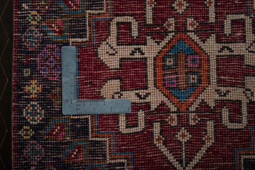 Backside of handmade 2000s Shiraz rug showing knot structure and weave density